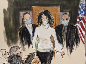 Ghislaine Maxwell enters the courtroom escorted by U.S. Marshalls at the start of her trial, Monday, Nov. 29, 2021, in New York City.