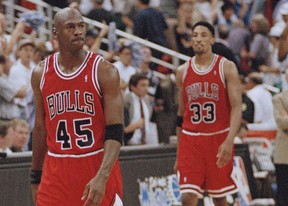 In this May 7, 1995, file photo, Chicago Bulls guard Michael Jordan (45) and forward Scottie Pippen (33) walk back to the bench during a timeout in the closing seconds of an NBA basketball playoff game in Orlando.