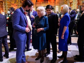 Canadian Prime Minister Justin Trudeau speaks to Camilla, Duchess of Cornwall, on Nov. 1, 2021 as they attend an evening reception to mark the opening day of the COP26 summit in Glasgow, Scotland.