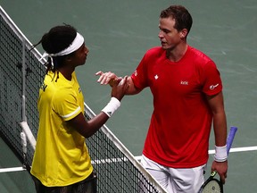 Sweden's Mikael Ymer celebrates after winning his match against Canada's Vasek Pospisil during the Davis Cup Finals at Madrid Arena in Spain.