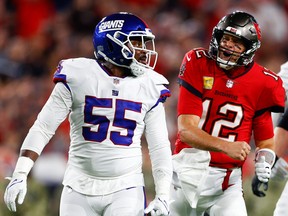 Tampa Bay Buccaneers quarterback Tom Brady (12) reacts after a run in the first half against the New York Giants at Raymond James Stadium on Nov. 22, 2021.