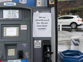 A vehicle looks for fuel at at gas station that has run out of gas on Nov. 18, 2021 in Abbotsford, B.C.