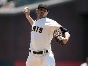 Starting pitcher Kevin Gausman delivers a pitch during a game against the Arizona Diamondbacks last season while a member of the San Francisco Giants. Gausman is joining the Blue Jays.