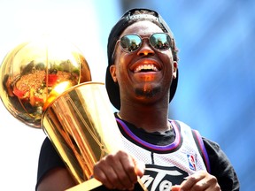 Kyle Lowry #7 of the Toronto Raptors holds the championship trophy during the Toronto Raptors Victory Parade on June 17, 2019 in Toronto, Canada.