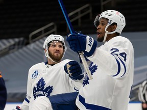 Both Hockey Diversity Alliance leader Wayne Simmonds (right) and Maple Leafs player rep Alexander Kerfoot (left) say the team has been united in its determination to make sure the what Kyle Beach went through never happens again.