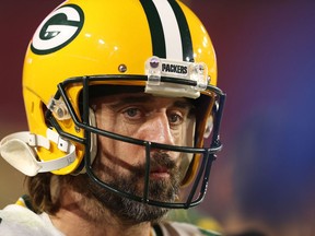 Aaron Rodgers #12 of the Green Bay Packers watches action during the second half of a game against the Arizona Cardinals at State Farm Stadium on October 28, 2021 in Glendale, Arizona.