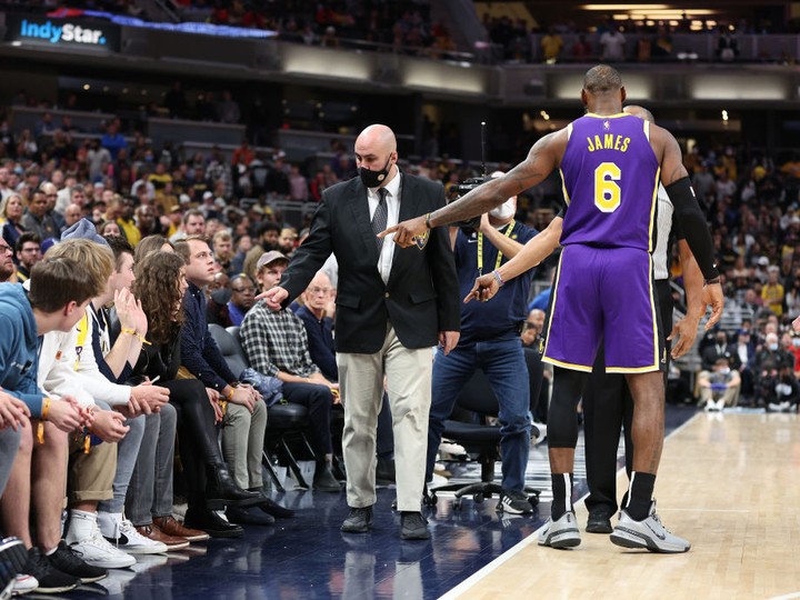  LeBron James #6 of the Los Angeles Lakers points out fans that he had a disturbance with to security during the game against the Indiana Pacers at Gainbridge Fieldhouse on November 24, 2021 in Indianapolis, Indiana. (Photo by Andy Lyons/Getty Images)