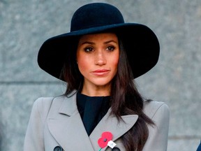 Meghan Markle, the US fiancee of Britain's Prince Harry, attends an Anzac Day dawn service at Hyde Park Corner in London on April 25, 2018.