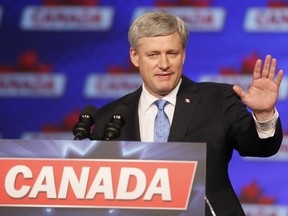Stephen Harper speaks to Conservative speaks to supporters at the Telus Convention Centre in Calgary, Alta., on Monday, Oct. 19, 2015.