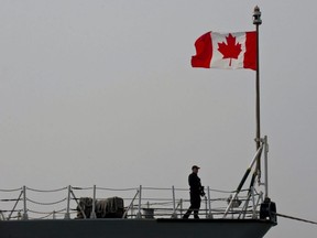 This file photo taken March 13, 2015, shows a Canadian soldier as he stands on board frigate HMCS Fredericton docked at Constanta Harbour in Constanta, Romania.