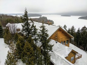 View of the lake from Sacacomie Hotel, a sprawling white pine log cabin-style structure in Saint-Alexis-des-Monts, Que.