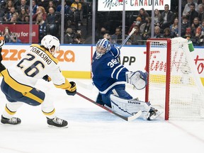 Nashville Predators' Philip Tomasino charges the net on Maple Leafs goaltender Jack Campbell during the first period at Scotiabank Arena on Tuesday, Nov. 16, 2021.