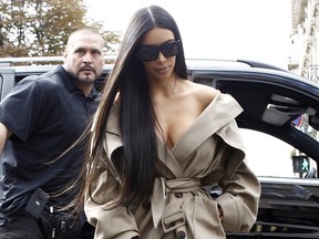Kim Kardashian is spotted out and about in Paris, France during Paris Fashion Week just hours before the reality star was held at gunpoint in her hotel room in the city.