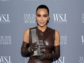 Kim Kardashian West poses with an award during the WSJ. Magazine 2021 Innovator Awards sponsored by Samsung, Harry Winston, and Remy Martin at MOMA in New York City, Monday, on Nov. 1, 2021.