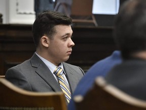 Kyle Rittenhouse listens as Judge Bruce Schroeder talks about how the jury will view video during deliberations in Rittenhouse's trial at the Kenosha County Courthouse in Kenosha, Wis., Wednesday, Nov. 17, 2021.