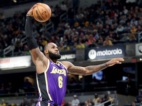 LeBron James of the  Los Angeles Lakers shoots the ball against the Indiana Pacers  at Gainbridge Fieldhouse on November 24, 2021 in Indianapolis, Indiana.