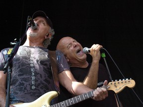 Guitarist Brian Smith and vocalist Ra McGuire perform for the crowd during opening night at Rock the Park on July 21, 2011 in London.