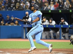 Blue Jays second baseman Marcus Semien hits a two-run home run against New York Yankees. Semien has reportedly signed a mega deal to join the Texas Rangers.