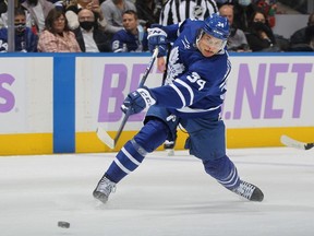 Auston Matthew of the Toronto Maple Leafs one times a shot against the Pittsburgh Penguins during an NHL game at Scotiabank Arena on November 20, 2021 in Toronto.