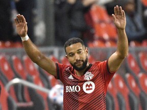 Toronto FC defender Justin Morrow salutes fans as he is substituted from his final MLS game in the second half against DC United at BMO Field on Sunday, Nov. 7, 2021.