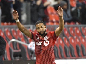Toronto FC defender Justin Morrow salutes fans as he is substituted from his final MLS game in the second half against DC United at BMO Field on Sunday, Nov. 7, 2021.