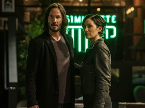 Keanu Reeves and Carrie-Anne Moss in a scene from The Matrix Resurrections.