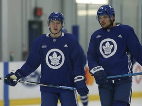 Maple Leafs forwards Mitch Marner, left, and Auston Matthews.