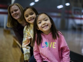Alessandra Folts (from front), her sister Mikaela Folts with mother Jolane Folts at Variety Village in Toronto, Ont. on Sunday, Nov. 28, 2021. ERNEST DOROSZUK/TORONTO SUN