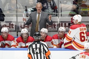 Calgary Flames head coach Darryl Sutter argues with an official during a game. AP PHOTO