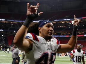 Jahlani Tavai of the New England Patriots reacts as the Patriots defeat the Falcons 25-0 at Mercedes-Benz Stadium on Nov. 18, 2021 in Atlanta, Ga.