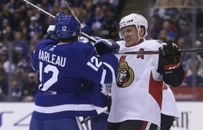 Dion Phaneuf, by then a member of the Ottawa Senators, trades jousts with former Maple Leaf Patrick Marleau in 2018. JACK BOLAND/SUN FILES