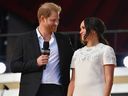 In this file photo taken on September 25, 2021 Britain's Prince Harry and Meghan Markle speak during the 2021 Global Citizen Live festival at the Great Lawn, Central Park in New York City. 