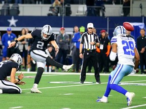 Raiders kicker Daniel Carlson kicks the winning field goal in overtime against the Dallas Cowboys in Arlington yesterday. Getty Images
