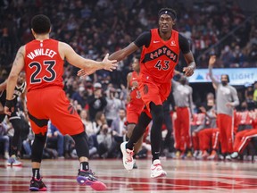 Fred VanVleet #23 celebrates with Pascal Siakam #43 of the Toronto Raptors during the first half of their NBA game against the Brooklyn Nets at Scotiabank Arena on November 7, 2021.