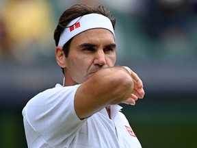 In this file photo taken on July 07, 2021, Roger Federer plays Hubert Hurkacz during Wimbledon at The All England Tennis Club in Wimbledon, London.