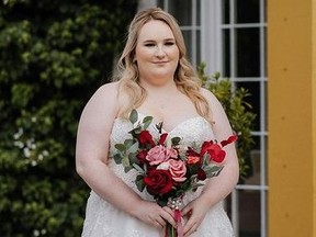 Woman on her wedding day holding bouquet.