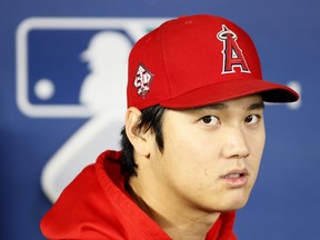 Shohei Ohtani of the Los Angeles Angels looks on before the game against the Seattle Mariners at T-Mobile Park on Oct. 3, 2021 in Seattle, Washington.