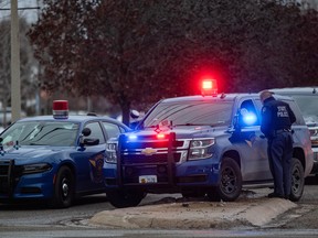 Emergency personnel respond to the scene of a deadly shooting where at least three were killed and six were wounded at a high school in Oxford, Michigan, about 35 miles (55 km) north of Detroit, November 30, 2021.