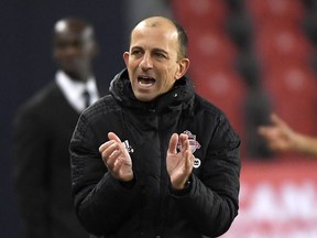 Toronto FC manager Javier Perez applauds his players against Pacific FC in the second half of the Canadian Championship semi-final at BMO Field on Nov. 3, 2021.