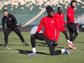 Alphonso Davies stretches during the Canadian Men's national football squad practice ahead of FIFA World Cup 2022 qualifying game with Costa Rica on Friday. Taken on Wednesday, Nov. 10, 2021 at Commonwealth Stadium in Edmonton.