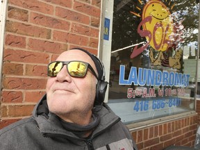 Steve Thamer, a voiceover narrator and prog-rock musician, sits outside on Queen St. E. in The Beach enjoying a sunny fall day on Friday, Nov. 5, 2021.