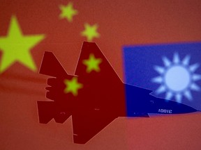 Chinese and Taiwanese flags are displayed alongside a military airplane in this illustration taken April 9, 2021.