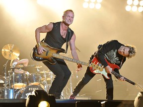 Lead vocalist and bassist Sting, guitarist Andy Summers and drummer Stewart Copeland of British rock band The Police perform during a concert at the Tokyo Dome on 13 February, 2008.