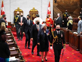Governor General Mary Simon, her husband Whit Fraser and Prime Minister Justin Trudeau leave after the Speech from the Throne in the Senate of Canada in Ottawa November 23, 2021.