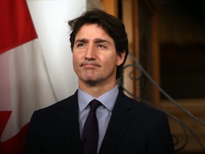 Prime Minister Justin Trudeau talks to media about the recent B.C. flooding at the legislature during a press conference in Victoria, B.C., on Friday, Nov. 26, 2021.