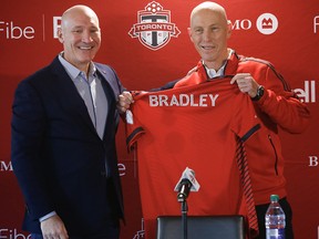 Toronto FC president Bill Manning (L) introduces new team coach and sporting director Bob Bradley at Downsview in Toronto, Ont. on Wednesday November 24, 2021. Jack Boland/Toronto Sun/Postmedia Network
