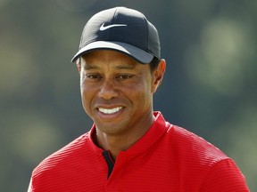 Tiger Woods reacts after finishing on the 18th green during the final round of the Masters at Augusta National Golf Club in Augusta, Ga., on Nov. 15, 2020.