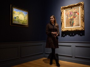 A painting by Vincent Van Gogh entitled 'Meules de blé' (left) is displayed at Christie's auction house in New York on October 29, 2021.