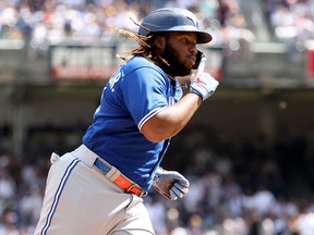 Toronto Blue Jays' Vladimir Guerrero Jr. gestures as he rounds the bases after hitting his 40th home run at Yankee Stadium on Monday in New York.