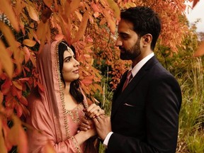 Nobel Peace Prize laureate Malala Yousafzai stands next to husband Asser in a picture published with a social media post in which she announced her marriage, in Birmingham, Britain, November 9, 2021.
